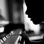 silhouette, child at piano, photo by Victor Bezrukov
