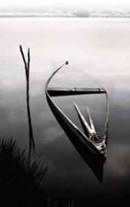 b/w sunken dinghy with oars